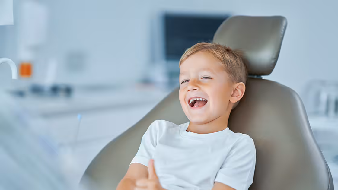 Cosmetic dentistry for children boy at dentist
