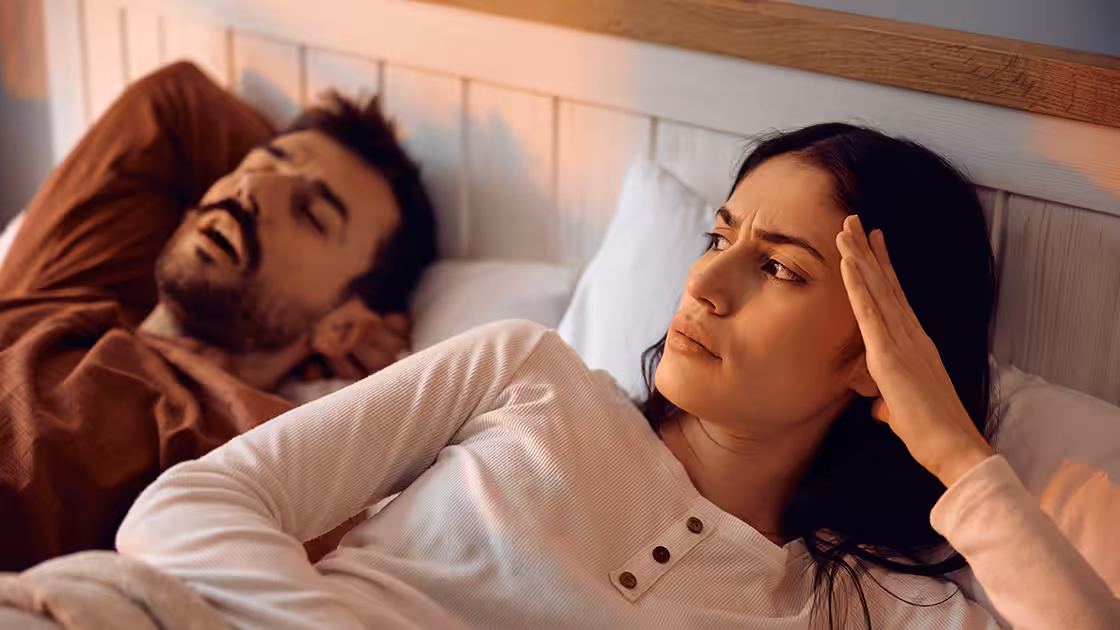 Spouse next to snoring patient